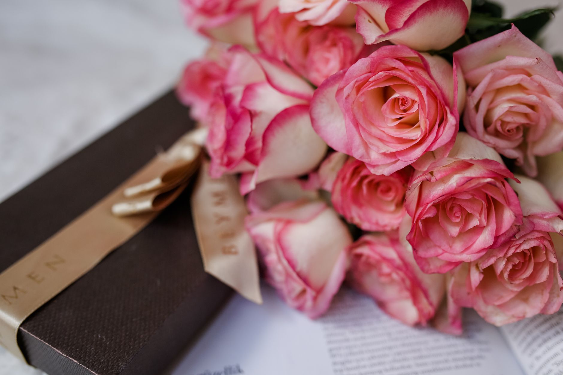 A close-up bouquet of pink and white roses